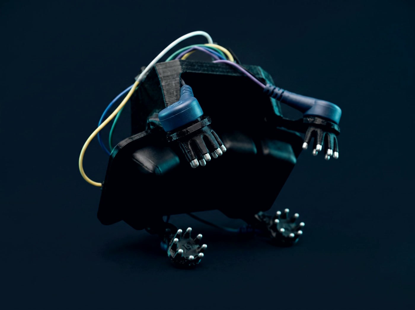 Close view of the ThinkSYNC dry comb electrodes mounted on the headset frame.